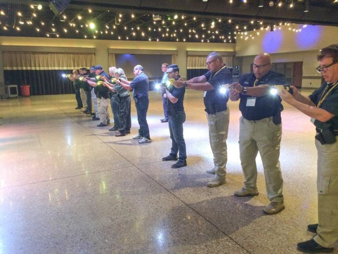 Taser trainers run practice drills with the new Taser 7 in the ballroom of a conference center outside Fort Worth in October.